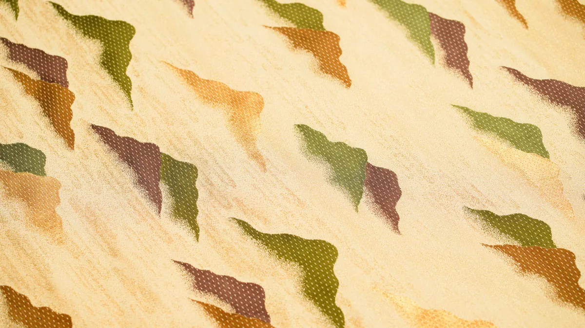 Gold brocade with a pattern of green, brown and orange mountain peaks